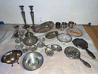 Overview of lot showing candlesticks, platters, cups and bowls