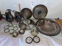 Overview of all sterling serving pieces on white background