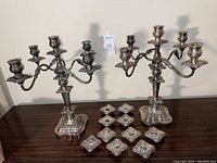 Overall group shot of two candelabra with ten inserts