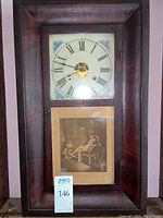 Full front view of the vintage wooden mantel clock showing clock face and printed image panel beneath.