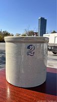 Side view of the salt glazed crock showing the blue number '2' marking indicating a 2-gallon capacity.
