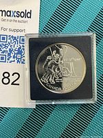 Front side of the coin showing three hockey players celebrating a goal with inscriptions indicating the 1972 hockey series between Canada and USSR and the denomination 'Canada Dollar'.