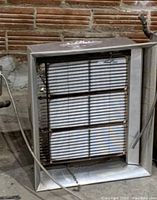 Front view of the natural gas heater showing the heating elements inside the metal casing.