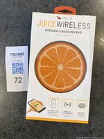Front of Helix Juice Wireless Charging Pad box showing orange slice design and product name.