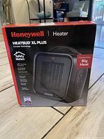 Boxed Honeywell Heatbud XL Plus Ceramic Heater packaging showing the front design and features.