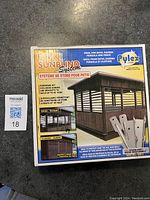 Photo showing the front of box for Pylex Quick Sunblind System hardware kit including screws and brackets for decks, gazebos, pergolas, fences.