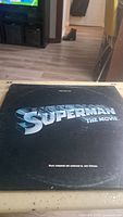 Photo of the black album cover of Superman The Movie soundtrack with silver text.