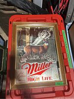 Framed Miller High Life mirrored sign showing front with deer graphic and text.