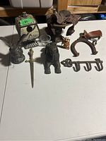 Full display of all metal collectible and decorative items showing all shapes and sizes