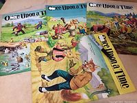 Photo showing the 4 magazines from above, covers visible with colorful animal illustrations