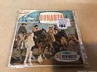 Photo showing original Bonanza story booklet and sealed View-Master reels set with 21 stereo pictures.