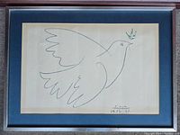Framed art print showing Picasso's line drawing of a peace dove with olive branch, signed and dated