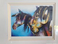 Close-up of the colorful lithograph showing three horses with artistic brush strokes and details.