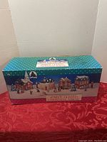 Original closed box showing the product packaging for 18 Piece Lighted Christmas Towne set