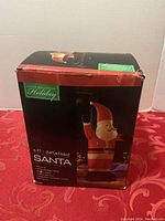 Box front showing 6ft Inflatable Santa with brand Holiday Creations and Christmas Seasons Holiday line.