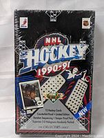 Front view of sealed 1990-91 Upperdeck NHL hockey card box with logos and product details visible.
