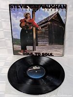 Front cover and vinyl record visible, showing artwork and condition.