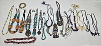 Full layout of all costume jewelry necklaces and beaded strands showing various sizes and designs.