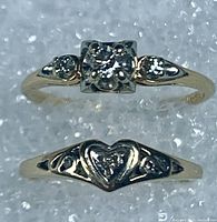 Top view of both rings on textured background