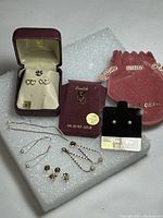 Overview of all gold jewelry items on foam background
