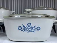 Close-up of medium Pyrex Blue Cornflower casserole dish with clear glass lid showing floral pattern and white opaque glass