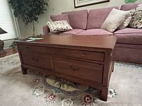 Front view of the rectangular coffee table in living room setting