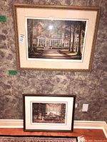 Two Trisha Romance prints on wall and floor, labels visible, showing overall condition and framing