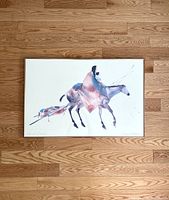 Framed watercolor-style print showing a mother and child riding a horse in abstract soft colors.