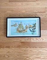 Full view of framed vintage Asian shell wall art decor showing sailing ship and mountainous background.