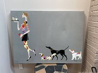 Full view of canvas art print showing entire scene of woman and dogs on gray-blue background.