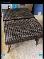 Two brown wicker tables stacked together showing full structure and size