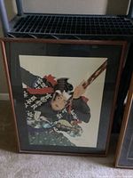 Framed Japanese samurai artwork depicting Miyamoto Musashi, view of full artwork in glass front frame.