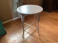 Side perspective showing table height, leg design, and floor placement