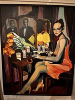 Photo of signed and framed painting of a woman seated at a vanity with flowers, bottles, and reflected men in tuxedos.