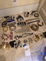 Overview of all jewelry pieces laid on floor