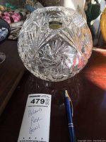 Full view of the spherical lead crystal rose bowl with detailed cut patterns and Polish origin sticker.