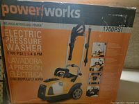 Photo of the boxed Power Works electric pressure washer with branding, capacity, and features visible on the packaging.