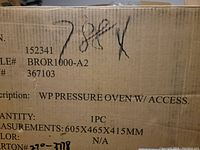 Photo showing box label with product description, dimensions, and quantity, confirming brand new Wolfgang Puck Pressure Oven with accessories.