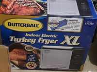 Butterball Indoor Electric Turkey Fryer XL box front showing brand, model and turkey frying capacity up to 20 lbs.