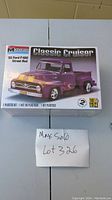 Front of sealed Monogram plastic model kit box showing '55 Ford F-100 Street Rod Classic Cruiser purple truck with flame decals and kit scale 1:24.