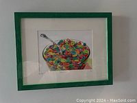 Front view of the signed art print depicting a bowl of colorful Fruit Loops cereal, framed in green.