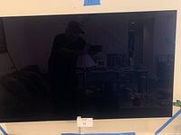 Front view of wall-mounted 55-inch TV