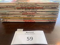 Stack of 20 vintage movie magazines, spines showing various titles and dates including Movie Life July 1972, Hollywood Romances 1960, Hollywood Secrets Yearbook, Movie Album and Movie Mirror.