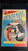 Front cover image of the 1966 Peter Cannon Thunderbolt comic book showing title, main characters, and story slogans.