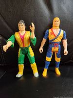 Front view of two Chuck Norris Karate action figures showing Reed Smith in green/yellow and Kimo in blue/yellow outfits