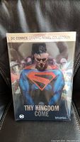 Front cover view of the sealed Kingdom Come hardcover graphic novel featuring DC Comics branding.