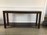 Front view of sofa table showing the drawer closed, espresso finish, rectangular design with thick legs and lower shelf.