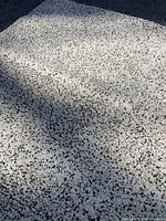 Photo showing the speckled texture and color pattern of the rug.