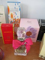 Front view of boxed fragrances including Moschino ‘I Love Love’, Givenchy Amarige and Fiori by Vince Camuto