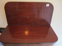 Front view of tabletop with one leaf raised